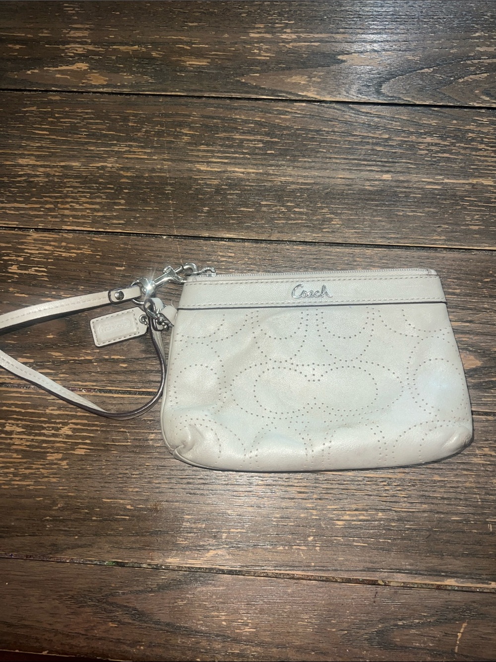 Coach gray Perforated Leather Wristlet with removable strap.